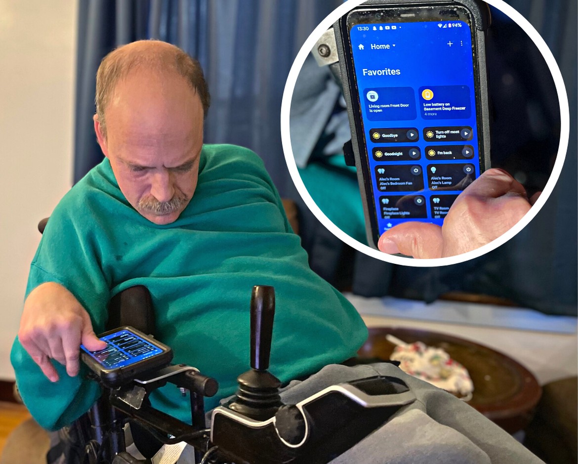 "Image of a man in a wheelchair using a smartphone"